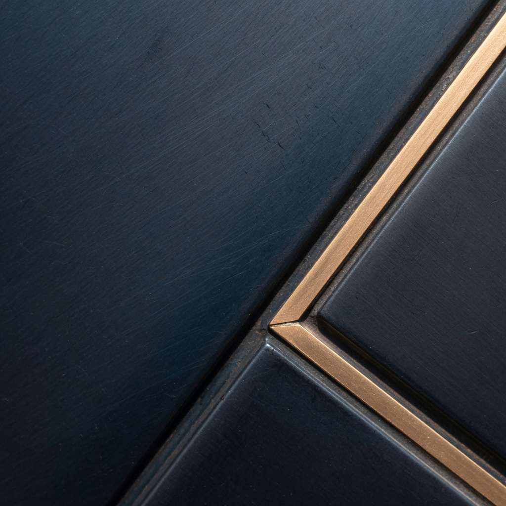 Brushed navy metal with a gold inlay